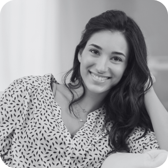 Woman smiling and leaning her head on her hand